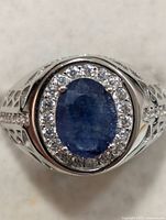Top view showing oval sapphire and CZ halo