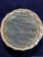 Front view of ring showing labradorite cabochon in silver bezel