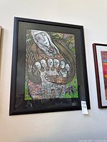 Full view of framed artwork on wall