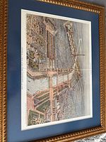 Full angled view of framed print showing image, mat and frame