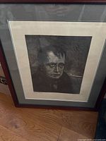 Framed portrait close-up showing artwork details