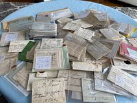 Wide view of large pile of 18th-century French letters and documents
