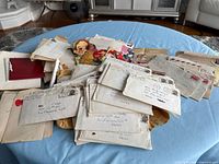 Overview of stacked letters and greeting cards on table
