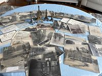 Wide view of spread out postcards with Eiffel Tower miniatures