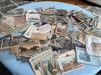 Overview of spread-out postcards and ephemera