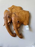 Front view of the carved elephant wall art
