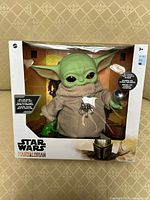 Front view of boxed Grogu figure