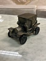 Front-left perspective of die-cast Buick coin bank