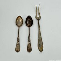 Front view of two coin silver teaspoons and one two-tine fork