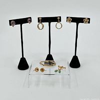 Group shot showing all jewelry items on stands and acrylic riser