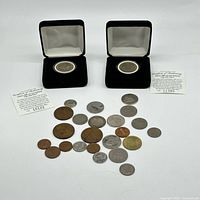 Overview of both boxed Vatican coins with COAs and 23 loose coins