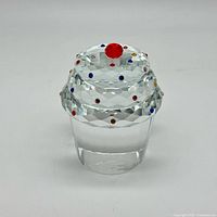 Front view of clear crystal cupcake paperweight showing colored rhinestones