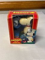 Front view of boxed Snoopy "World's Greatest Cook" wind-up action toy