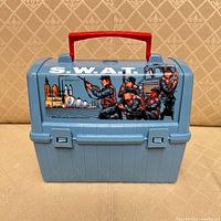 Front view showing S.W.A.T graphic and red handle