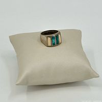 Front view showing turquoise and bone inlay on sterling silver band