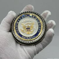 Top view showing United States Senate enamel seal under glass dome