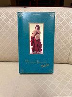 Front of closed teal display box showing product image and title