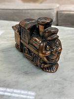 Front angled view of bronze-tone die cast Casey Jones #572 train coin bank