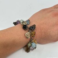 Bracelet worn on wrist showing scale and stone arrangement