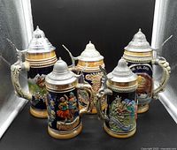 Front group view of all five lidded beer steins