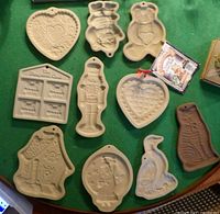 Group view of all nine ceramic cookie molds on table