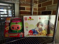 Front view of both packaged items on shelf