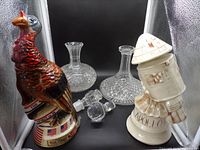 Full group: Wild Turkey decanter, Apollo decanter, two cut glass carafes, two glass stoppers