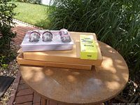 Overall lot showing two boxed toilet seats, Defiant lockset, Onn hardware kit