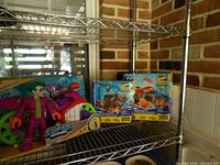 Shelf view showing Joker set and two Hot Wheels boxes