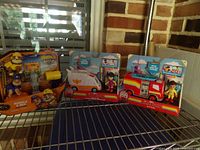 All four sealed toy packs on shelf