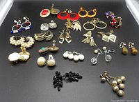 All 16 pairs arranged on black surface