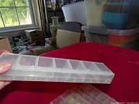 Front view of one translucent plastic bead container showing multiple compartments