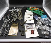 Full layout of bead strands, chains and packaged findings