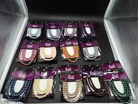 All 24 sealed Bead Treasures 6 mm glass bead packages laid out