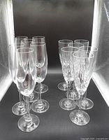 Front angled view of all 12 crystal champagne flutes