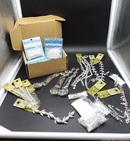 Entire lot overview with box of sealed packs, carded strands, loose beads and prisms displayed