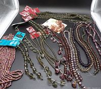 Overall lot showing all bead strands in various colors and shapes