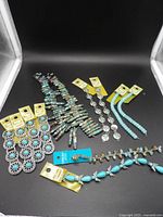 Full lot showing all bead strands on black background