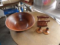 Overall view of salad bowl, napkin holder, pair of candle holders