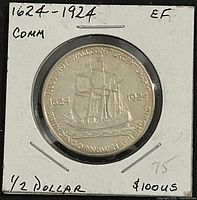 Reverse of 1924 half dollar in 2x2 holder showing ship design and dates