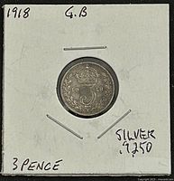 Reverse view showing 3 within wreath, date 1918