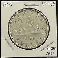 Reverse side showing CANADA DOLLAR legend, canoe design, year 1936