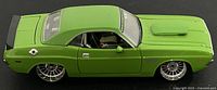 Left side view of green 1970 Dodge Challenger diecast showing body lines and chrome wheels