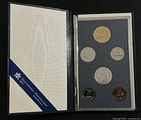 Open presentation case showing all six coins and RCM ribbon