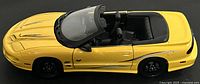 Top angle showing full yellow convertible model