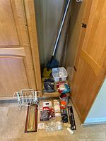 Overview of all items on floor beside cabinet