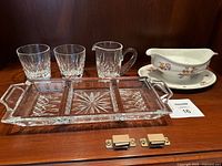 All items together: two crystal tumblers, two small crystal pitchers, crystal divided tray, porcelain gravy boat
