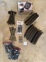 Lot overview with tracks, controller box, clip pack, trestle parts