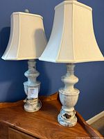 Both marble table lamps with shades visible