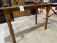 Table front angle showing legs and apron